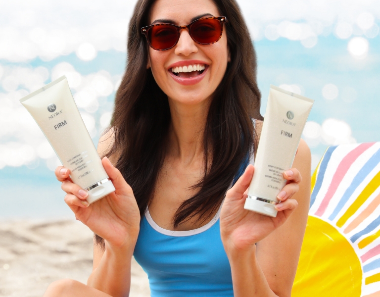 Woman smiling and holding Neora’s best-selling Firm Body Contour Cream 2-Pack—save up to $43 this month only.